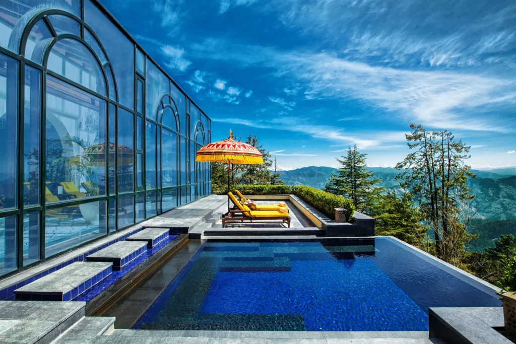 Panoramic view of North India mountains and historic Mughal architecture.